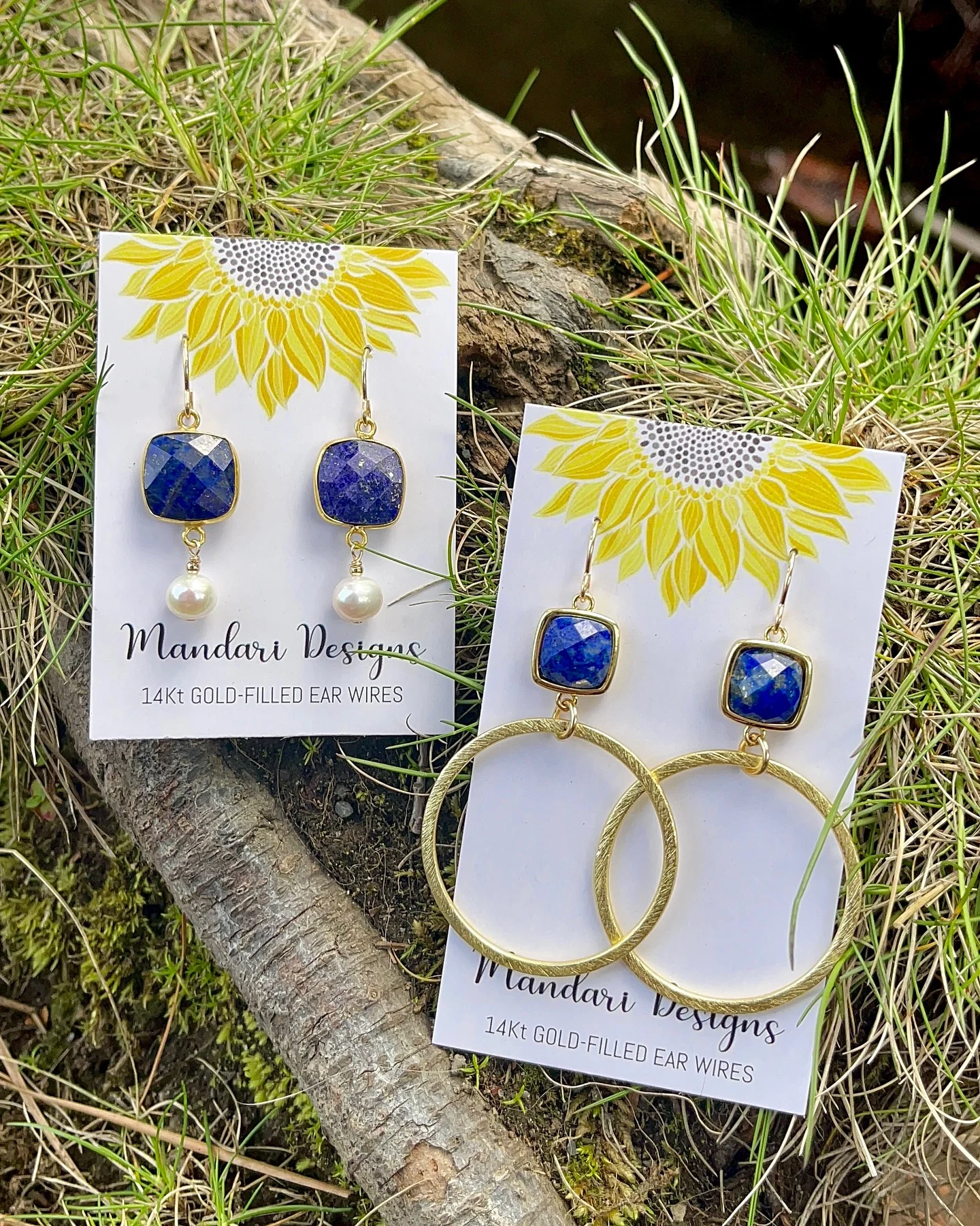 Mandari blue stone earrings on sunflower display cards, photographed on tree bark and grass